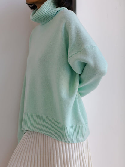 Cema – Jersey oversize con cuello alto
